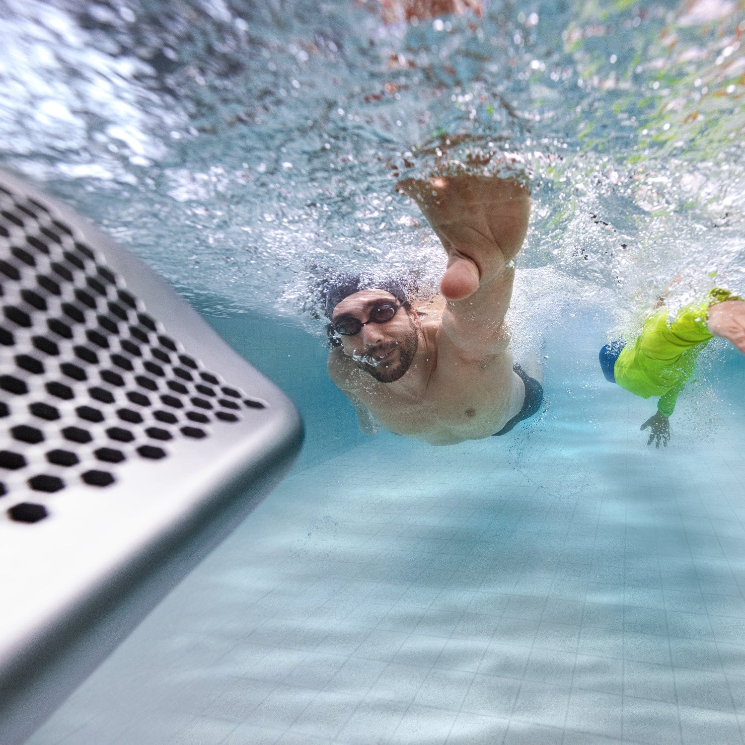 Luxury Swimming Pool Accessories | My Pool Direct Swimmer training against a counter-current swim jet